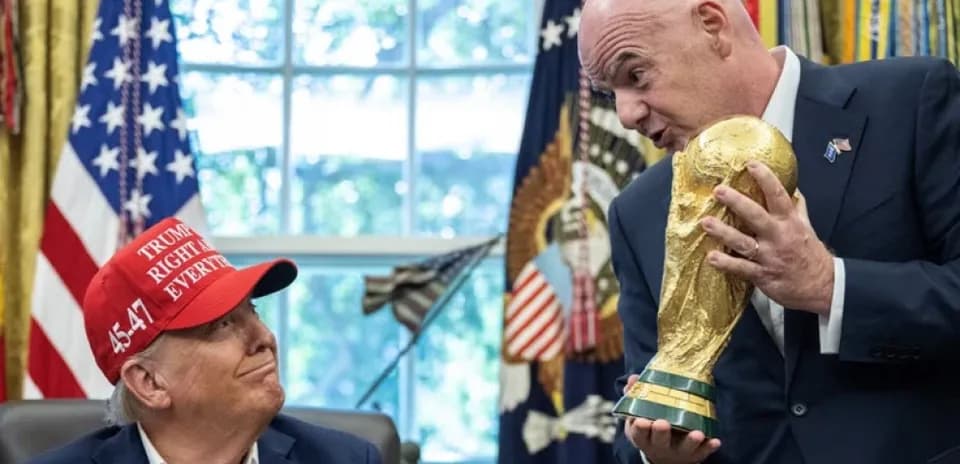 Donald Trump and FIFA president holding World Cup trophy