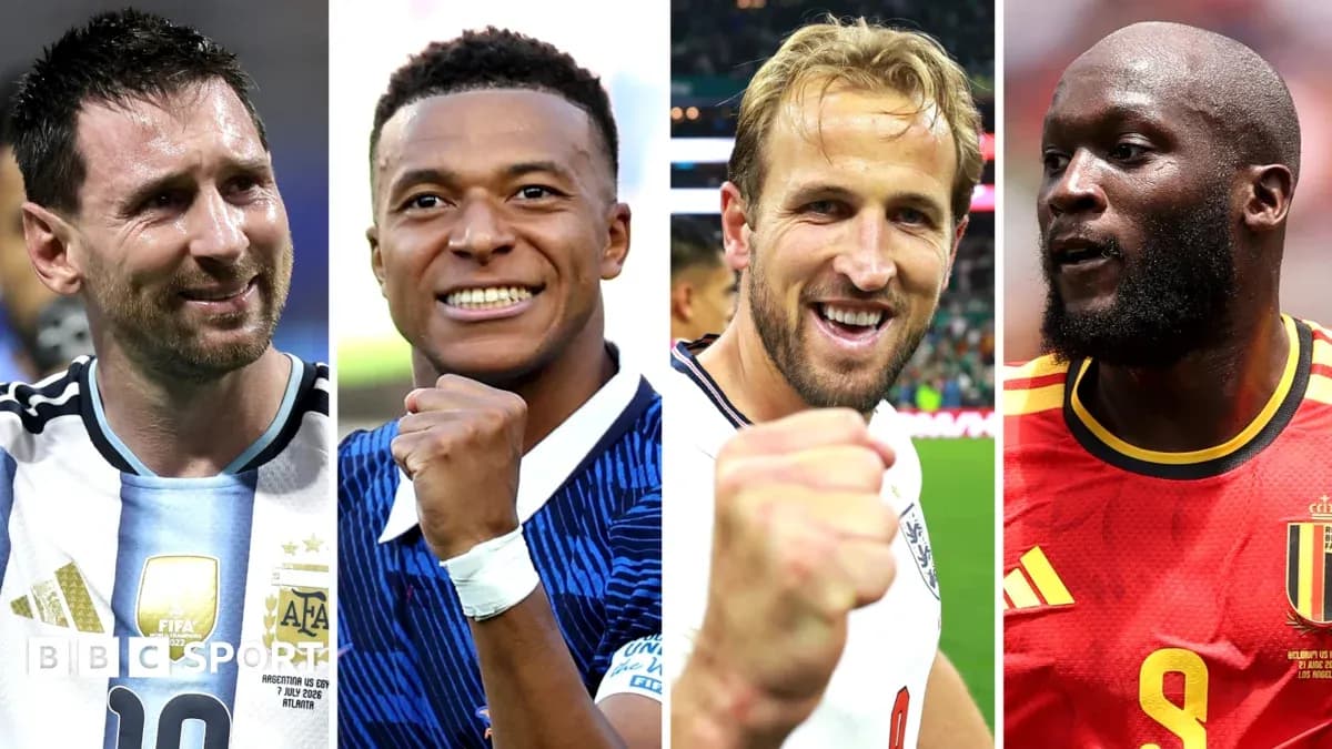 Four football players celebrating with raised fists