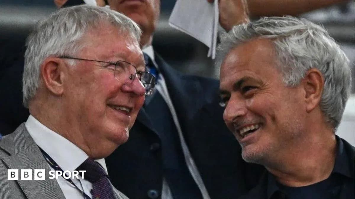 Two men smiling and talking in the stands Two men smiling and talking in the stands