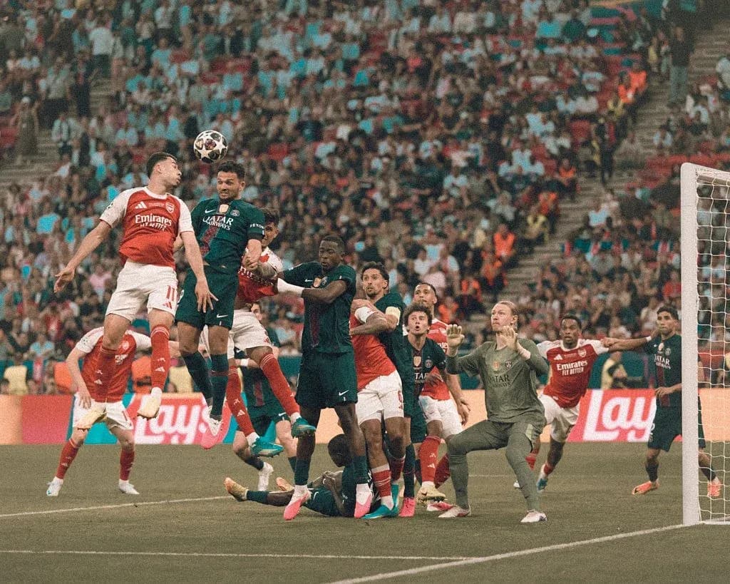 Players contesting a high ball in a match Players contesting a high ball in a match