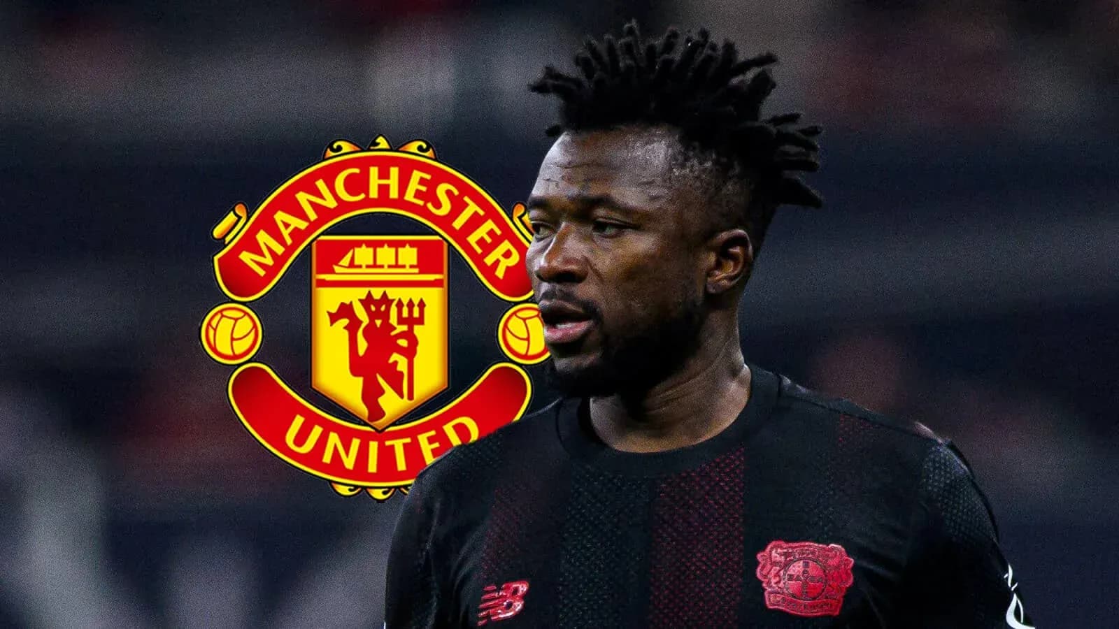 Игрок в черной форме с логотипом Manchester United Игрок в черной форме с логотипом Manchester United